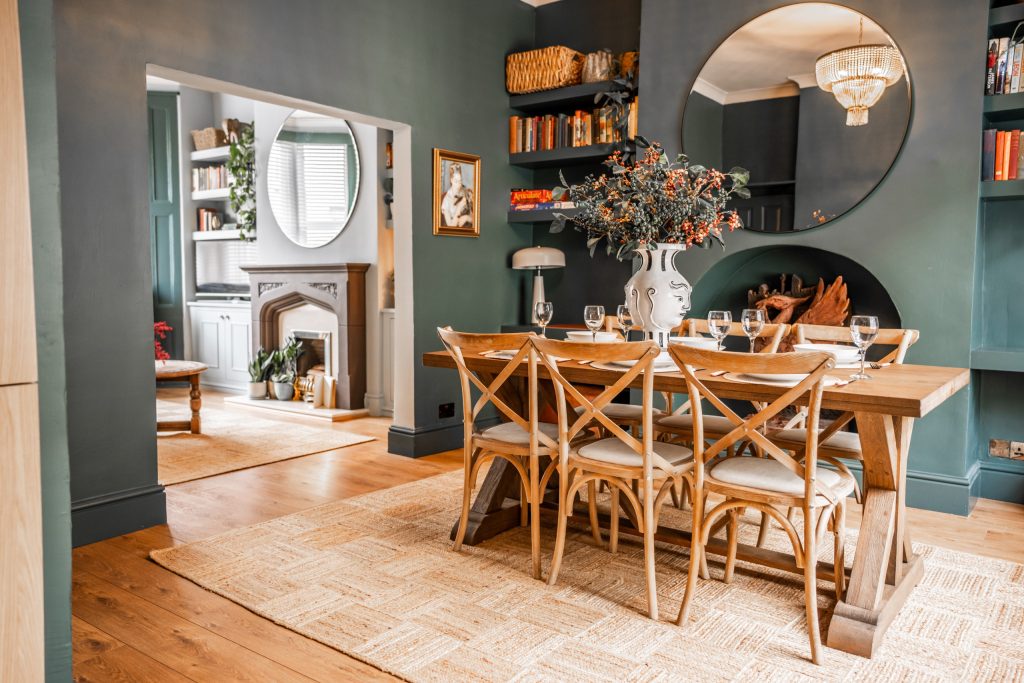 Discover the elegant dining space within this Anfield, Liverpool serviced accommodation, expertly styled by WildKind Interiors. The room features a solid oak dining table paired with six...