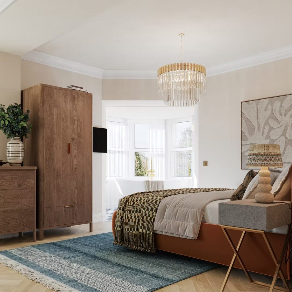 Bedroom with a walnut wardrobe, a bright bay window, a rust velvet bed and warm layered textiles.